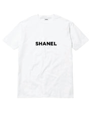 White t-shirt with 'SHANEL' printed on it against a white background