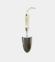 Gardening trowel with a wooden handle on a white background