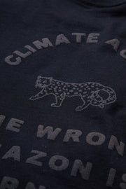 Dark blue shirt with white text and a leopard graphic, featuring a climate change message.