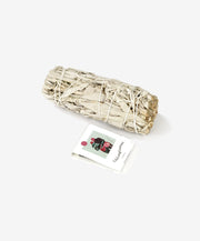 Bundled sage with a card on a white background