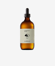 Brown glass bottle with dropper and label on a white background