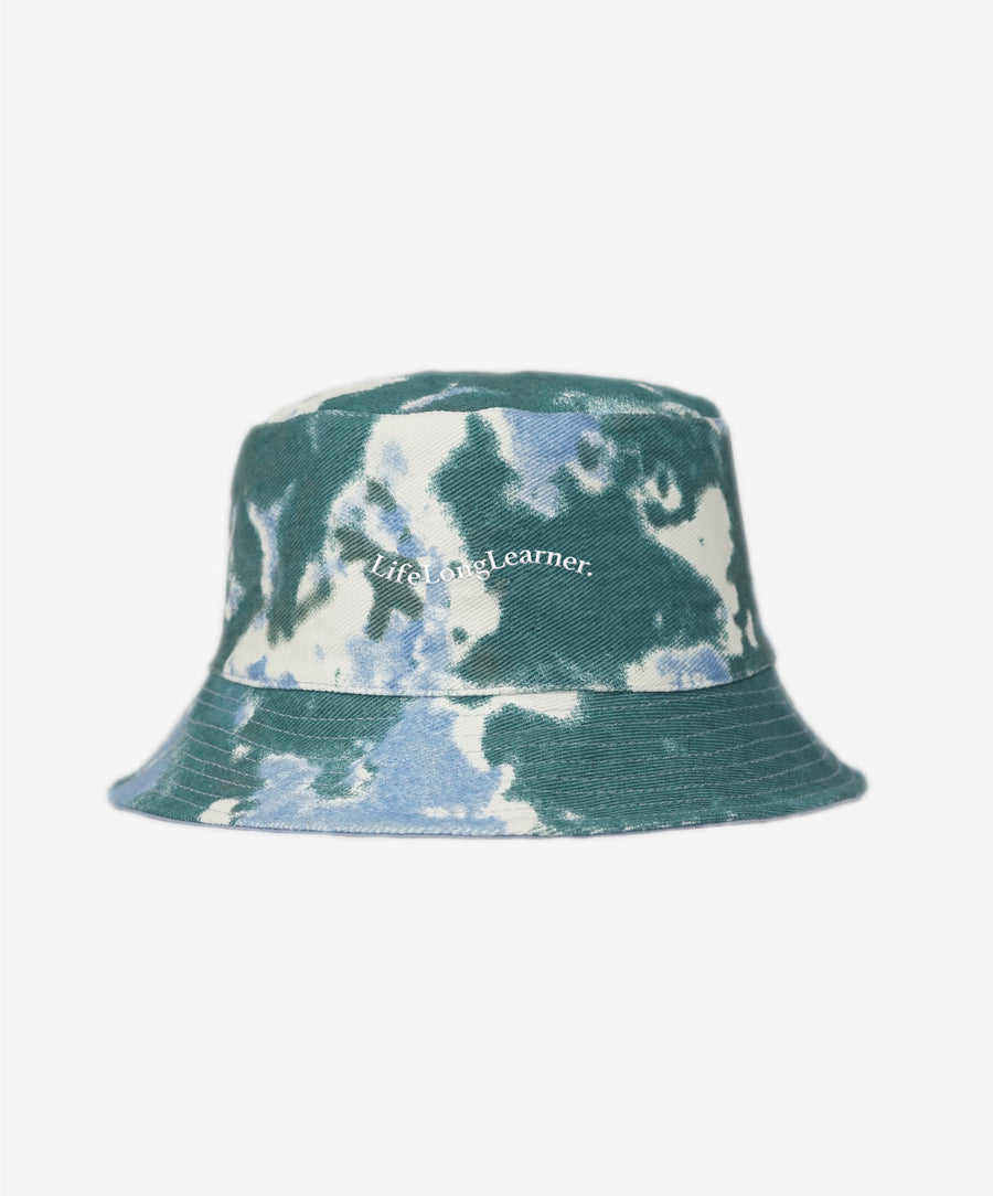 Tie-dye bucket hat with 'Life Long Learner' text on a white background