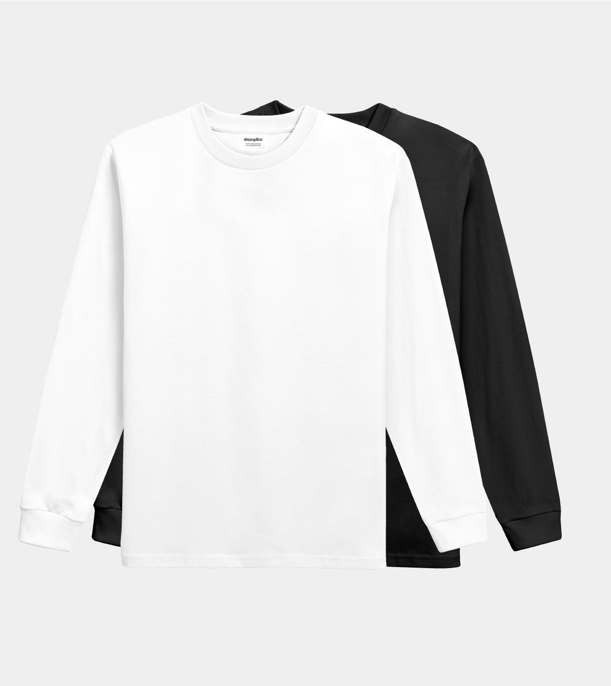 White long-sleeve shirt with black sleeves on a light gray background