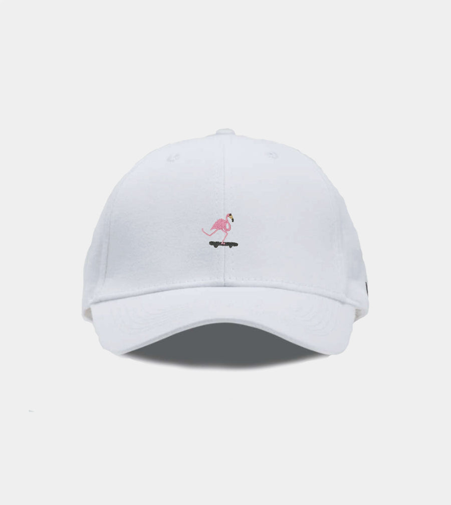 White cap with a pink flamingo design on a light gray background