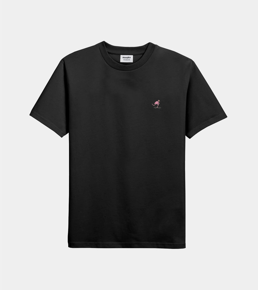 Black t-shirt with a small pink logo on a light gray background