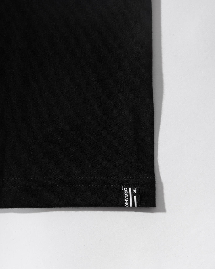 Black fabric corner with a visible brand logo on a white background