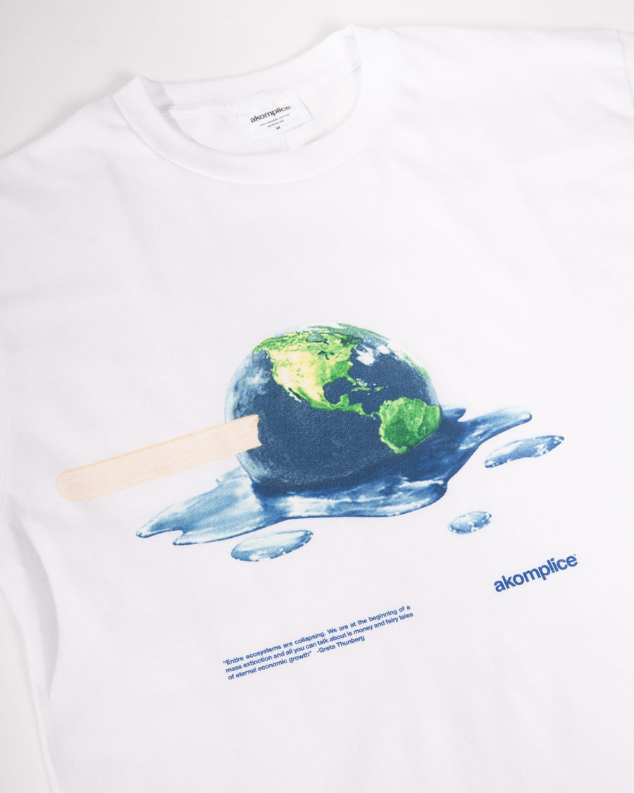 White t-shirt with a graphic of a melting ice cream cone with a world map, featuring the brand 'akomplice'.