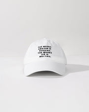White cap with black text on a white background