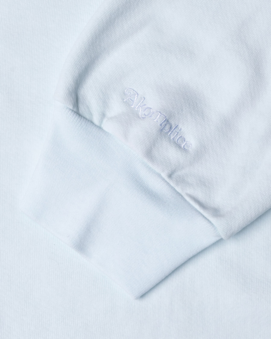 Light blue fabric with 'Alpina' branding on a matching background