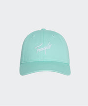 Mint green cap with white text on a light gray background