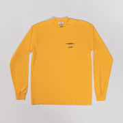 Yellow long-sleeve shirt with a black graphic and text on a gray background