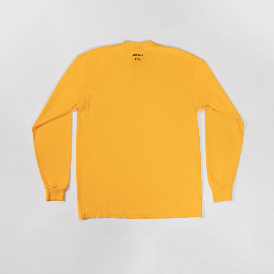 Yellow long-sleeve shirt on a light gray background