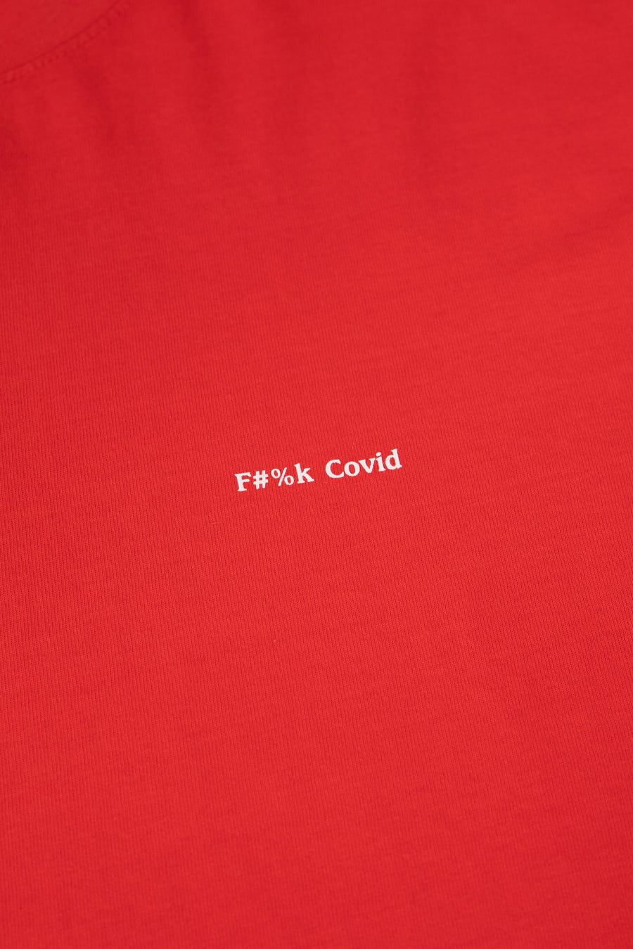 Red shirt with white text 'F#%k Covid' on a plain background