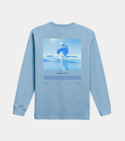 Light blue long-sleeve shirt with ocean-themed graphic and 'We Are Ocean' text on a light gray background