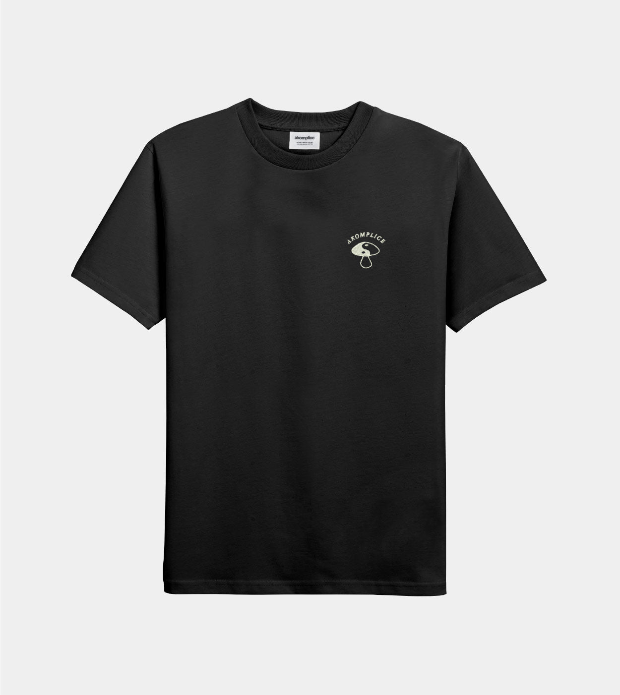 Black t-shirt with a small logo on a light gray background