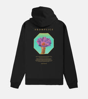 Black hoodie with floral design and 'AKOMPLICE' branding on the back against a white background