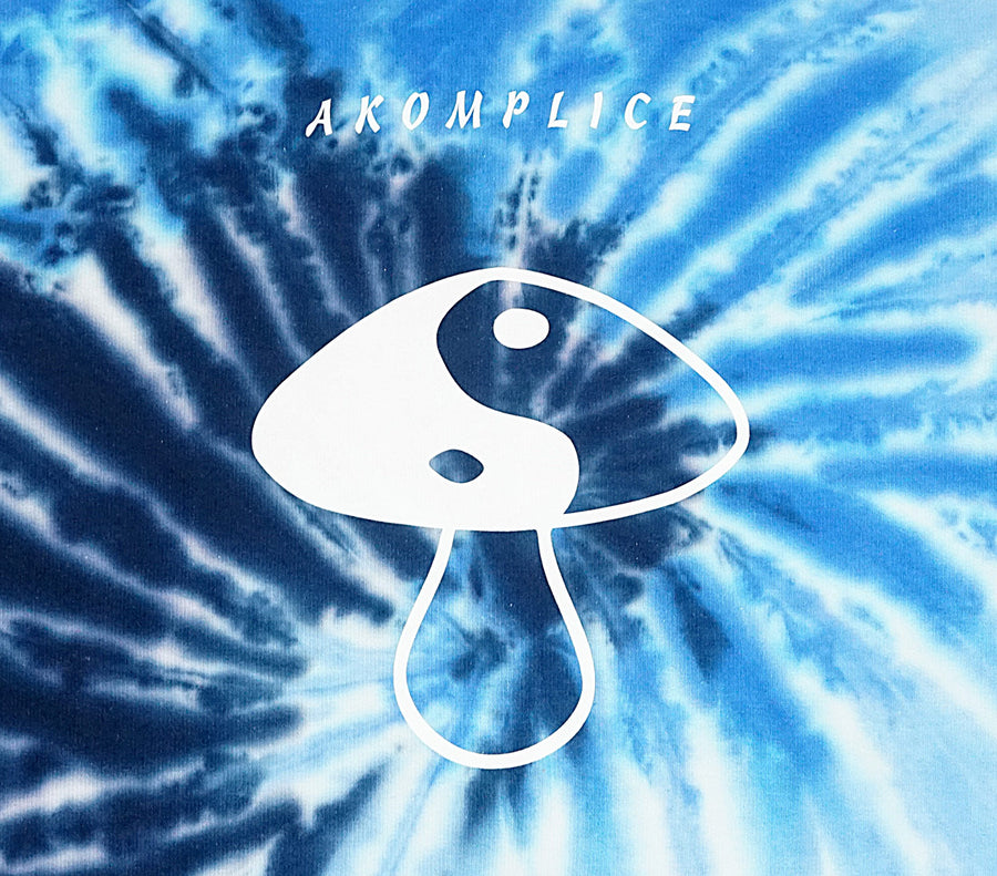 Tie-dye pattern with a white mushroom logo and 'AKOMPLICE' text