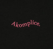 Pink Akomplice Logo on black background