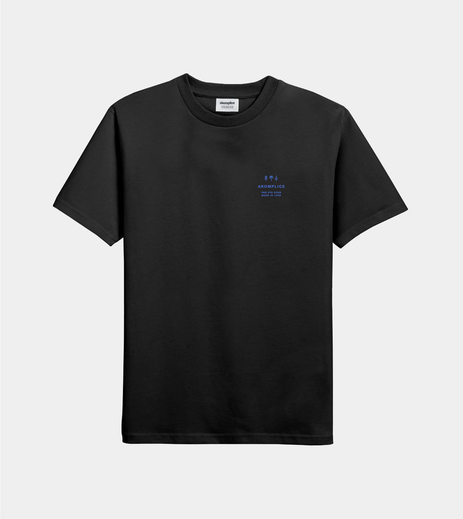 Black t-shirt with a small blue logo on a light gray background