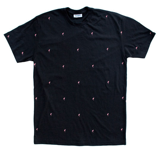 Black t-shirt with small pink patterns on a white background