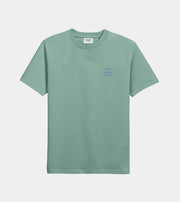 Green t-shirt with a small logo on a light gray background