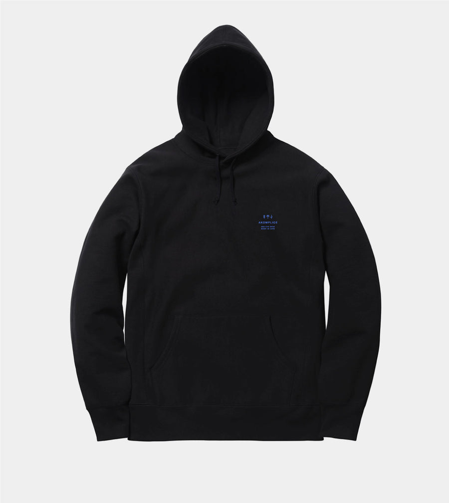 Black hoodie with a small logo on a light gray background