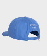 Blue cap with a brand logo on a light gray background