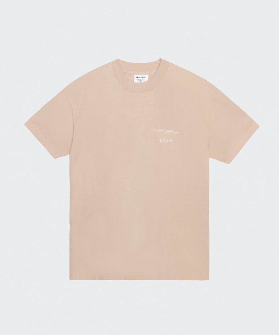 Beige t-shirt with a small logo on a white background