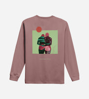 Pink long-sleeve shirt with a graphic of two people hugging on the back, set against a light purple background.