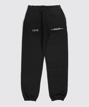 Black sweatpants with 'LOVE' and 'FEAR' text on a white background