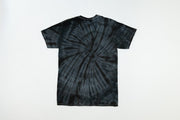 Tie-dye t-shirt with a black and gray spiral pattern on a white background