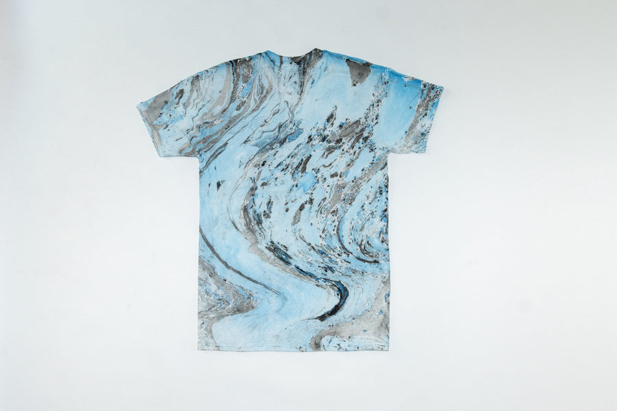 T-shirt with a blue and gray abstract pattern on a white background
