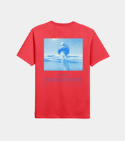 Red t-shirt with a graphic of a ship in the water on a white background