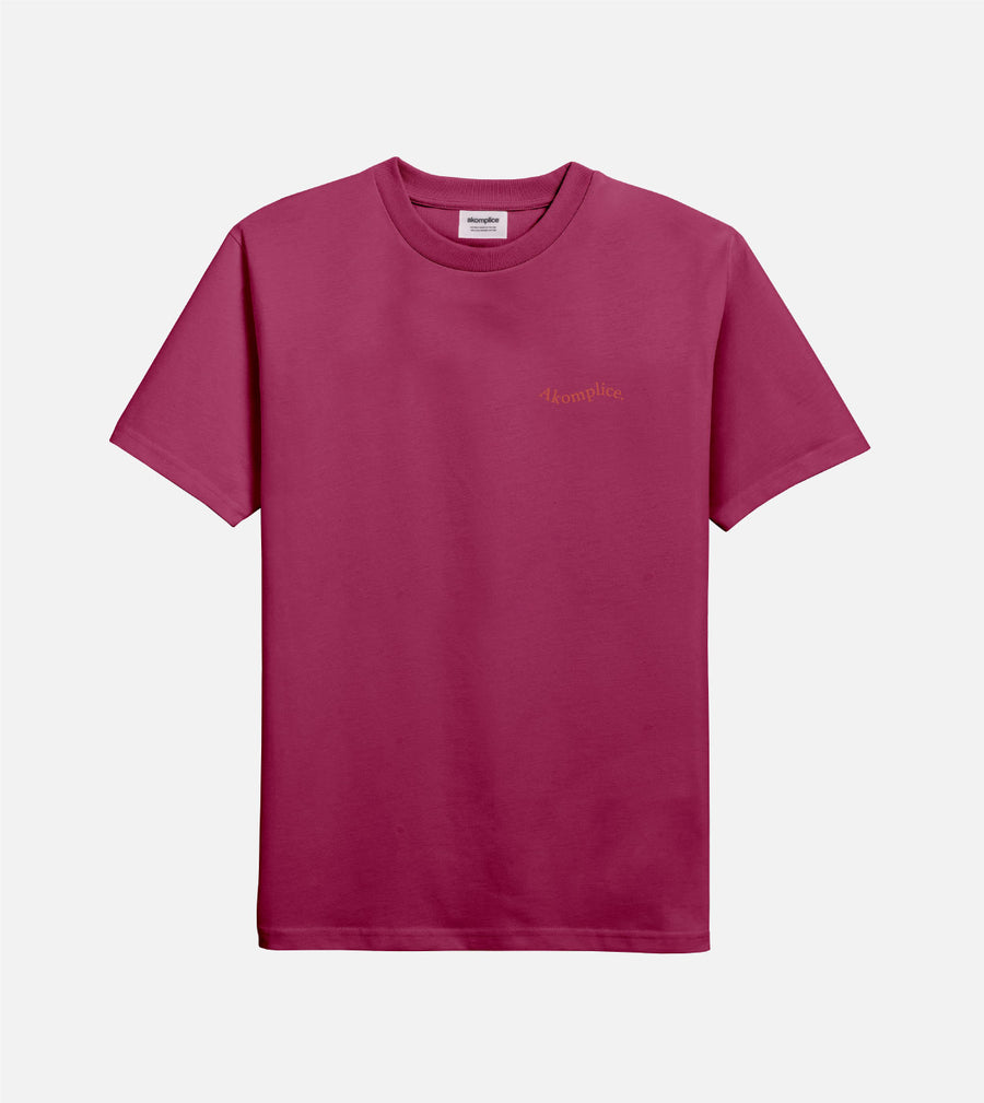 Pink t-shirt with a small logo on a white background