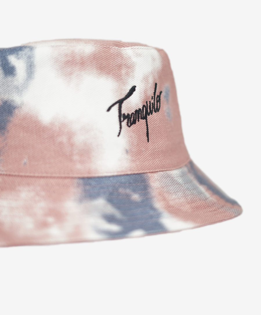 Tie-dye bucket hat with embroidered logo on a white background