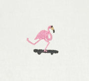 Embroidered flamingo design on a white fabric background