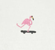 Embroidered flamingo design on a white fabric background