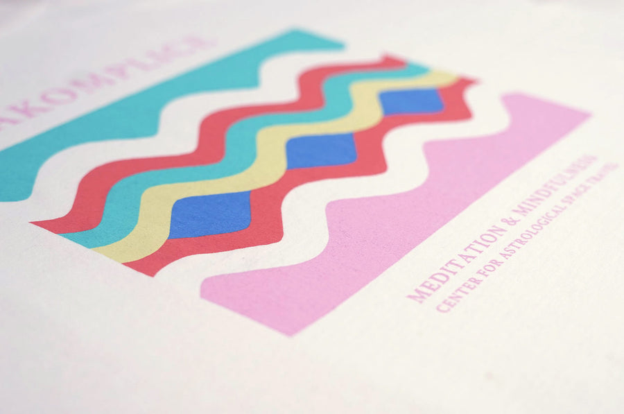 Colorful zigzag pattern on a white background with text overlay.