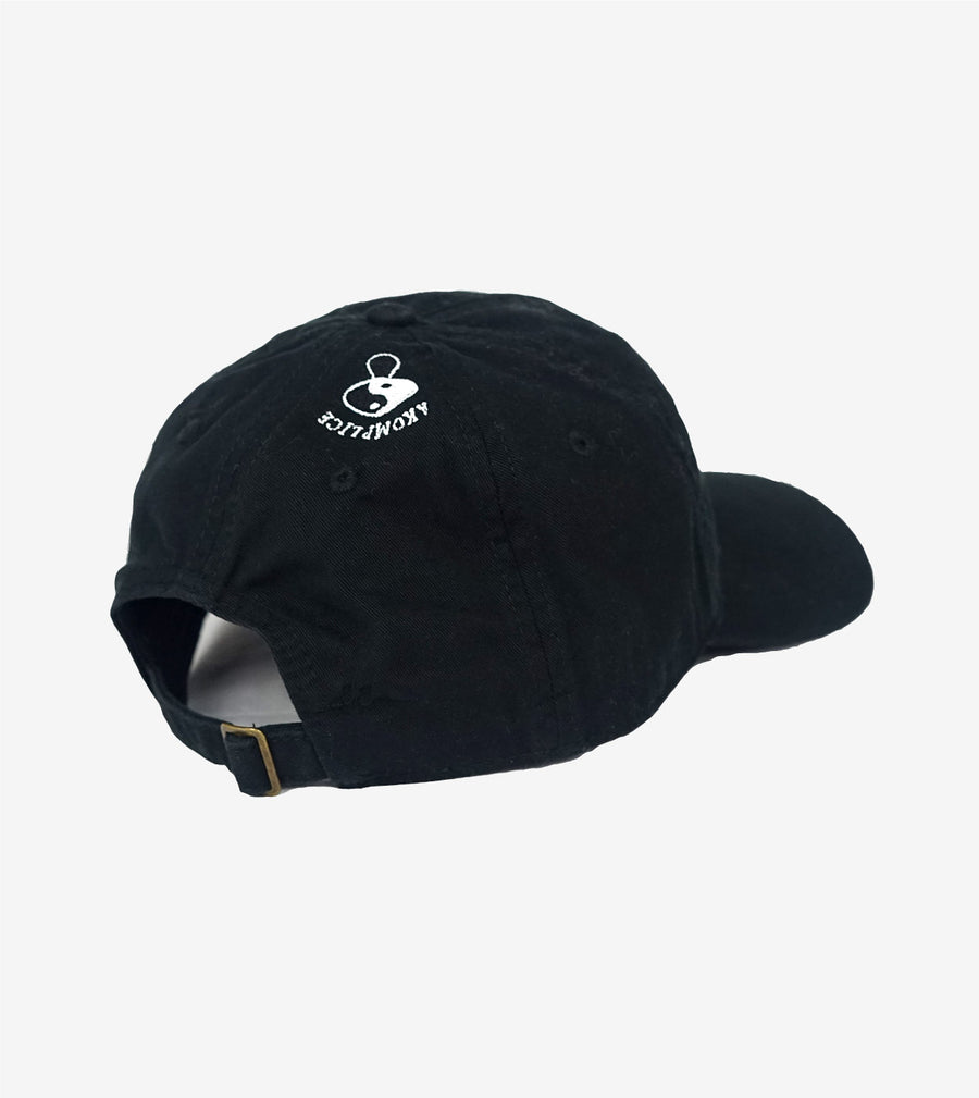 Black cap with a white logo on a light gray background