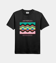 Black t-shirt with colorful graphic design and 'AKOMPLICE' branding on a white background