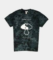 Tie-dye t-shirt with a mushroom graphic and 'Aromplice' branding on a light gray background