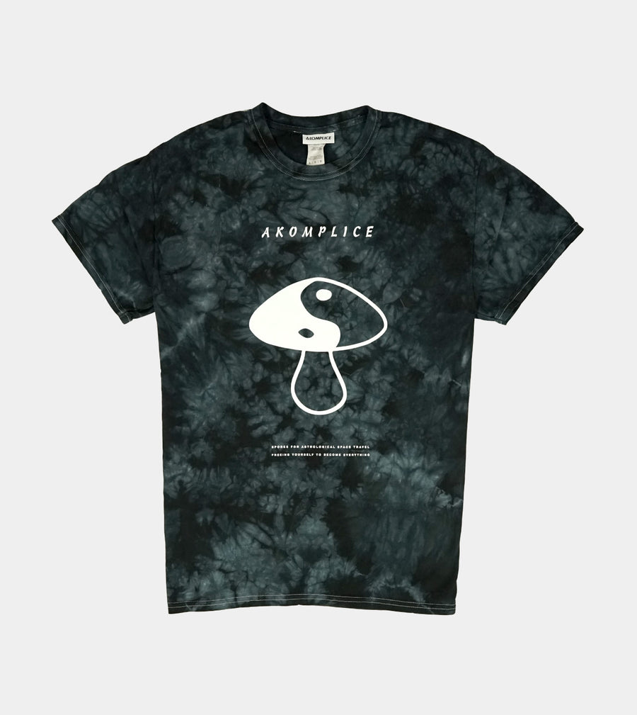 Tie-dye t-shirt with a mushroom graphic and 'Aromplice' branding on a light gray background