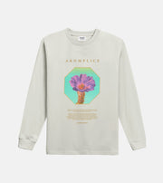 Beige long-sleeve shirt with a graphic design and 'Akomplice' branding on a white background