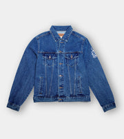 Blue denim jacket on a light gray background