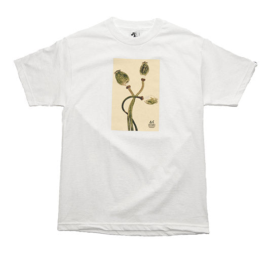 White t-shirt with a graphic of flowers on a beige background