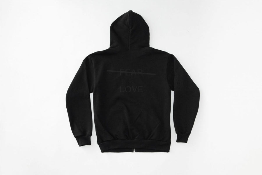 Black hoodie with text on the back against a white background
