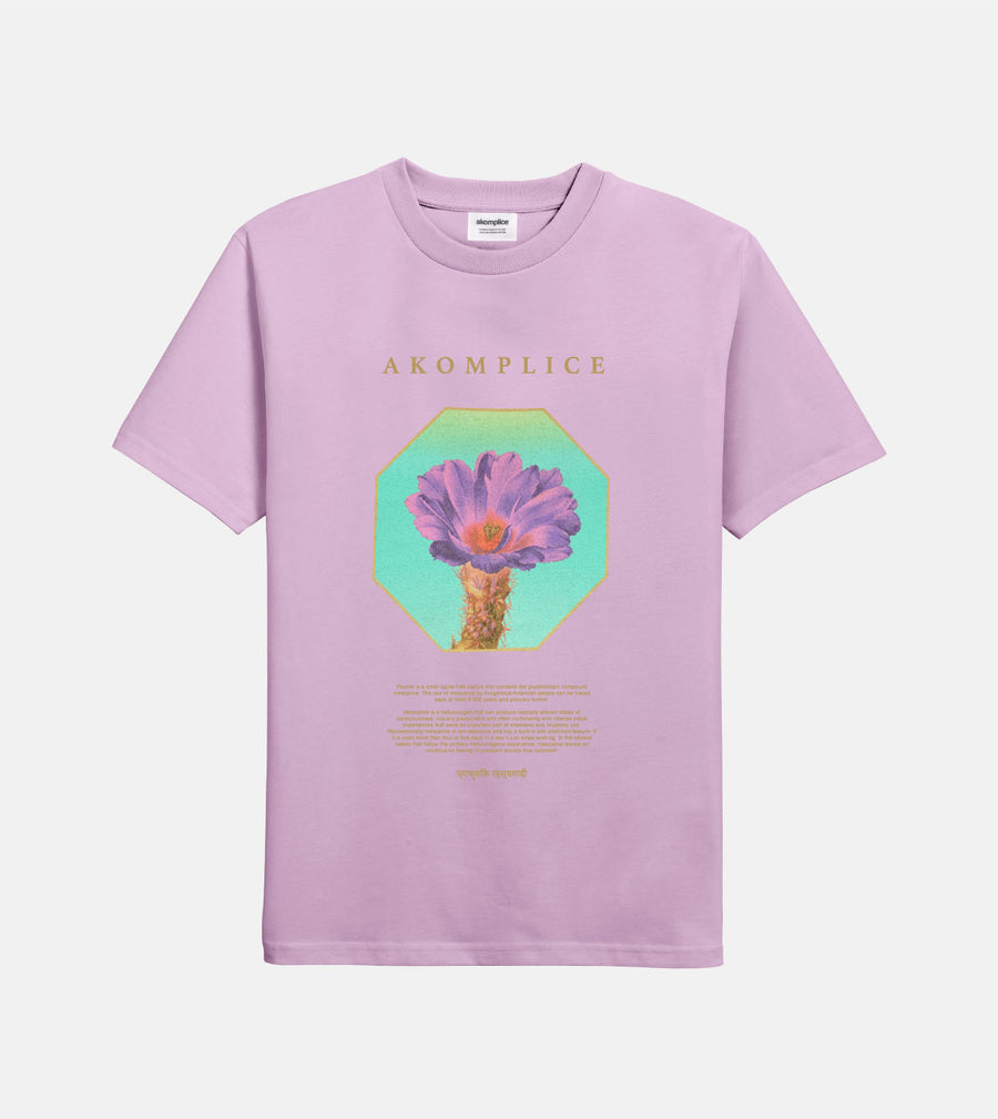 Lavender t-shirt with a graphic of a cactus and 'AKOMPLICE' branding on a light gray background