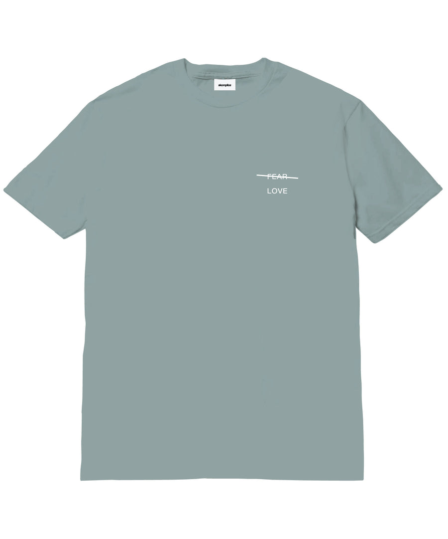 Light blue t-shirt with a small white logo and text on a white background