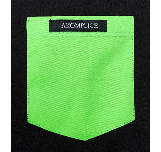Green pocket with Akomplice label on a black background