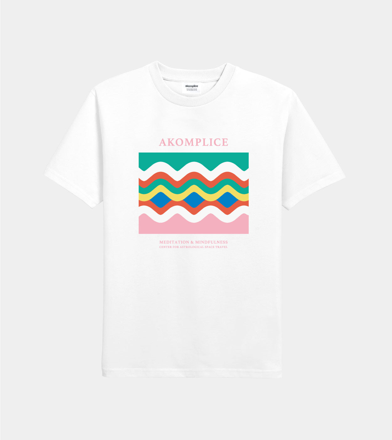 White t-shirt with colorful wavy design and 'AKOMPLICE' branding on a white background